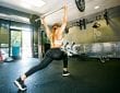 woman doing an overhead lift when working out