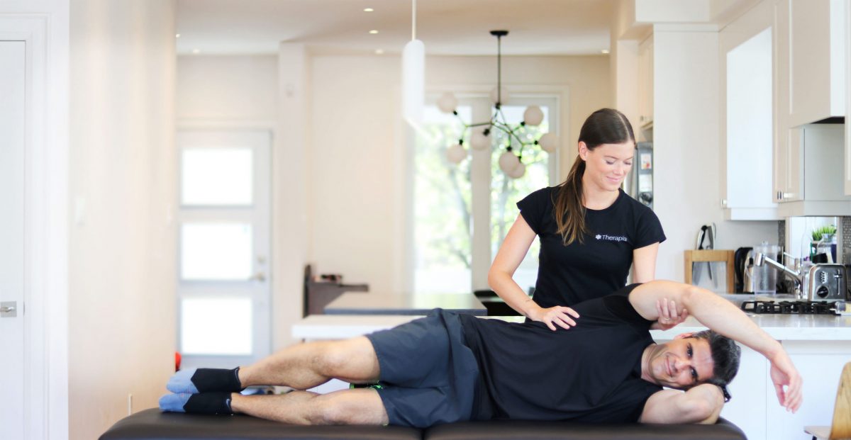 a physiotherapist working with a client