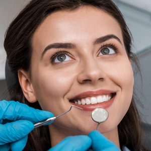 a woman getting her teeth cleaned