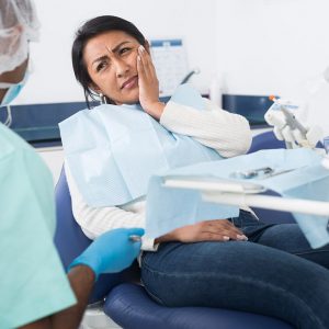 a woman experiencing tooth pain