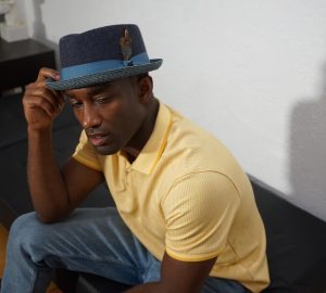 a man wearing a fedora hat