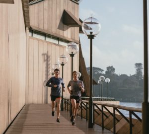 a couple running outdoors