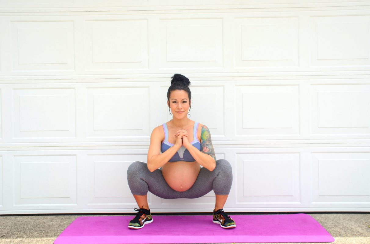 a pregnant woman exercising
