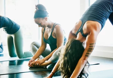 a group of women doing yoga