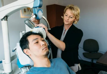 a man getting TMS Therapy