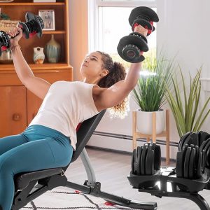 a woman exercising with adjustable dumbells