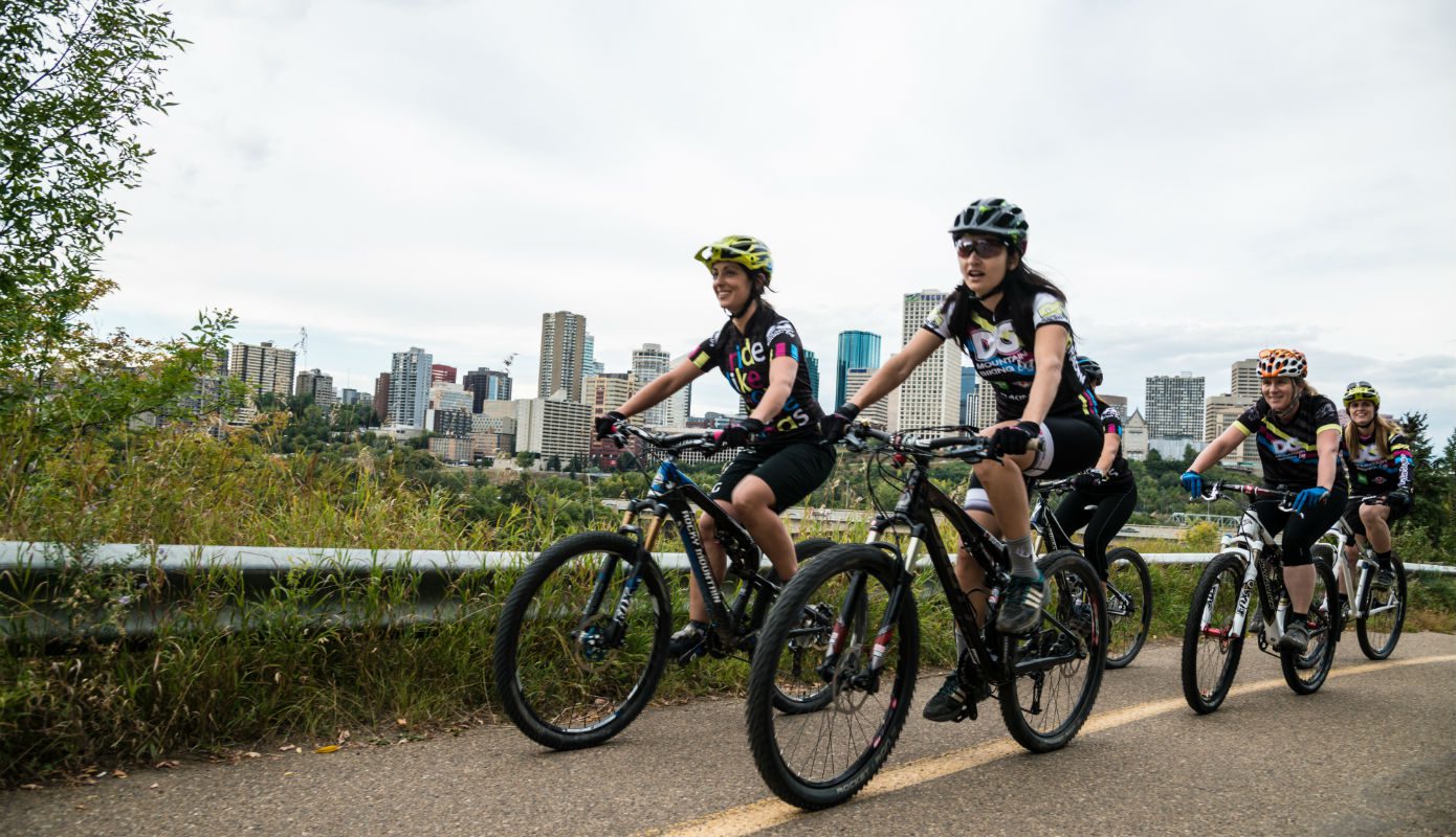 a group of cyclists in the edmonton river valley