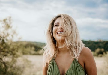a smiling woman outdoors