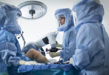 a group of doctors performing surgery