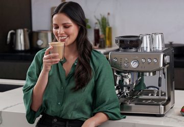 a woman enjoying a coffee beverage